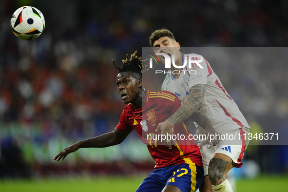 Giovanni Di Lorenzo right-back of Italy and SSC Napoli and Nico Williams left winger of Spain and Athletic Club Bilbao compete for the ball...