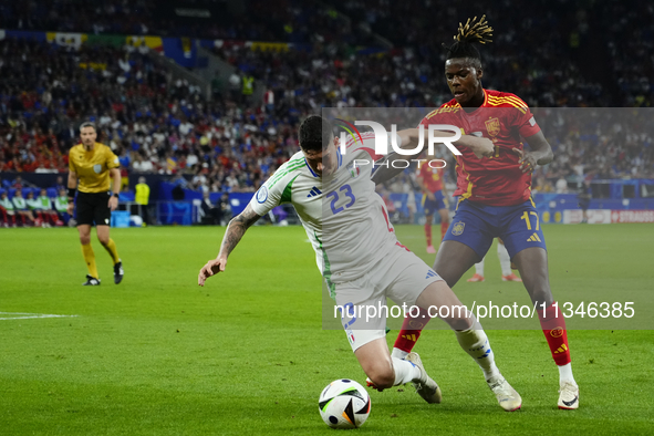 Alessandro Bastoni centre-back of Italy and Inter Milan and Nico Williams left winger of Spain and Athletic Club Bilbao during the UEFA EURO...