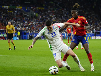 Alessandro Bastoni centre-back of Italy and Inter Milan and Nico Williams left winger of Spain and Athletic Club Bilbao during the UEFA EURO...