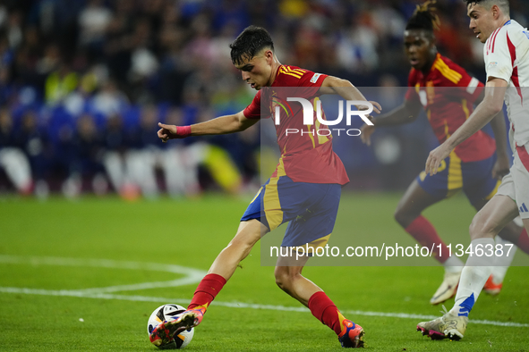 Pedri central midfield of Spain and FC Barcelona does passed  during the UEFA EURO 2024 group stage match between Spain and Italy at Arena A...