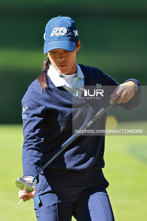 Celine Boutier of France checks her putter on the 17th green during the first round of the KPMG Women's PGA Championship at Sahalee Country...