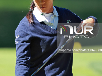 Celine Boutier of France checks her putter on the 17th green during the first round of the KPMG Women's PGA Championship at Sahalee Country...