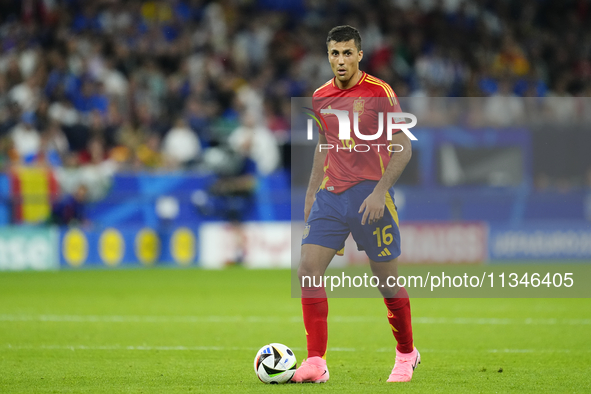 Rodrigo Hernandez defensive midfield of Spain and Manchester City during the UEFA EURO 2024 group stage match between Spain and Italy at Are...