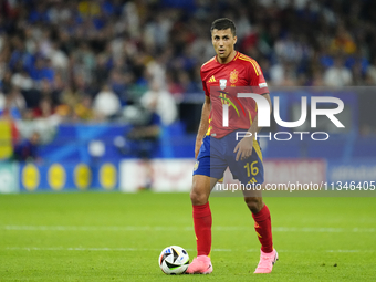 Rodrigo Hernandez defensive midfield of Spain and Manchester City during the UEFA EURO 2024 group stage match between Spain and Italy at Are...