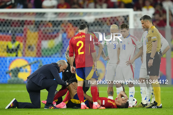 Rodrigo Hernandez defensive midfield of Spain and Manchester City lies injured on the pitch during the UEFA EURO 2024 group stage match betw...