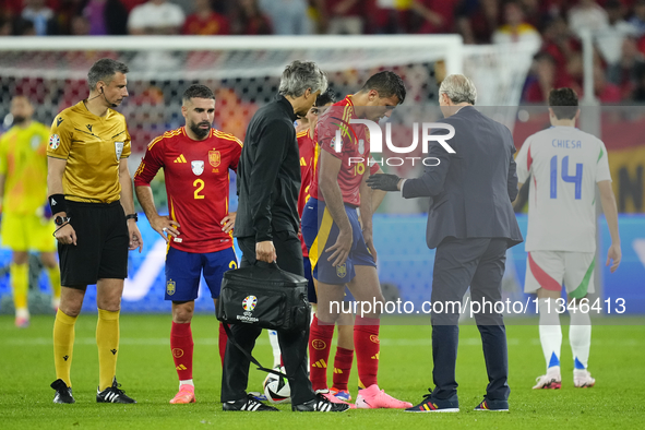 Rodrigo Hernandez defensive midfield of Spain and Manchester City lies injured on the pitch during the UEFA EURO 2024 group stage match betw...