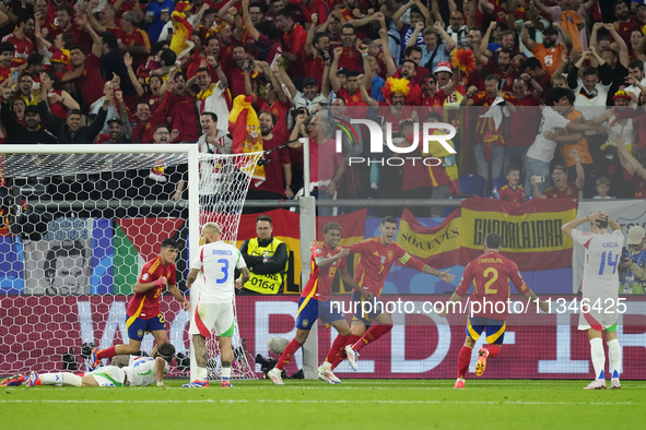 Spanish players celebrate after scoring his sides first goal during the UEFA EURO 2024 group stage match between Spain and Italy at Arena Au...