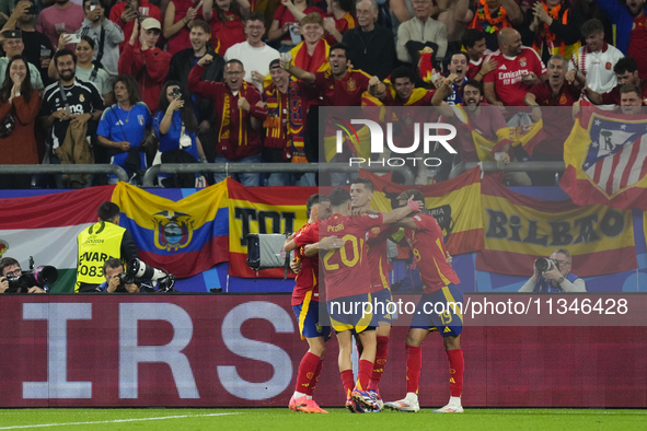 Spanish players celebrate after scoring his sides first goal during the UEFA EURO 2024 group stage match between Spain and Italy at Arena Au...