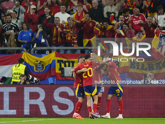 Spanish players celebrate after scoring his sides first goal during the UEFA EURO 2024 group stage match between Spain and Italy at Arena Au...