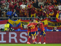 Spanish players celebrate after scoring his sides first goal during the UEFA EURO 2024 group stage match between Spain and Italy at Arena Au...