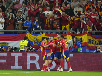 Spanish players celebrate after scoring his sides first goal during the UEFA EURO 2024 group stage match between Spain and Italy at Arena Au...