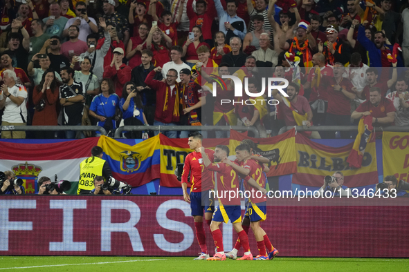 Spanish players celebrate after scoring his sides first goal during the UEFA EURO 2024 group stage match between Spain and Italy at Arena Au...