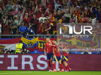 Spanish players celebrate after scoring his sides first goal during the UEFA EURO 2024 group stage match between Spain and Italy at Arena Au...