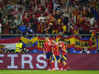 Spanish players celebrate after scoring his sides first goal during the UEFA EURO 2024 group stage match between Spain and Italy at Arena Au...