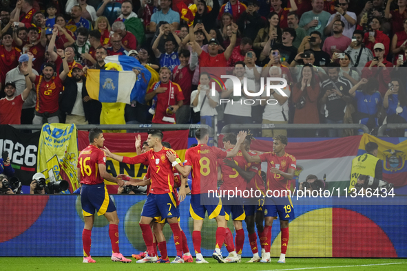 Spanish players celebrate after scoring his sides first goal during the UEFA EURO 2024 group stage match between Spain and Italy at Arena Au...