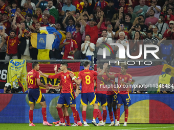 Spanish players celebrate after scoring his sides first goal during the UEFA EURO 2024 group stage match between Spain and Italy at Arena Au...