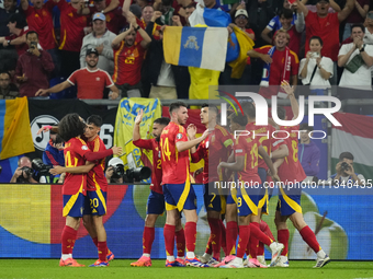 Spanish players celebrate after scoring his sides first goal during the UEFA EURO 2024 group stage match between Spain and Italy at Arena Au...