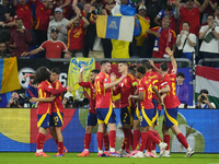 Spanish players celebrate after scoring his sides first goal during the UEFA EURO 2024 group stage match between Spain and Italy at Arena Au...