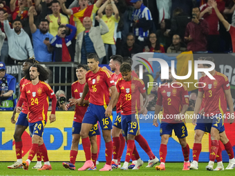 Spanish players celebrate after scoring his sides first goal during the UEFA EURO 2024 group stage match between Spain and Italy at Arena Au...