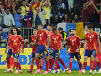 Spanish players celebrate after scoring his sides first goal during the UEFA EURO 2024 group stage match between Spain and Italy at Arena Au...