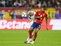 Federico Dimarco left-back of Italy and Inter Milan and Lamine Yamal right winger of Spain and FC Barcelona compete for the ball during the...