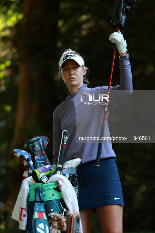 Nelly Korda of the United States pulls a club from her bag as she prepares to tee off on16th hole during Day One of the KPMG Women's PGA Cha...