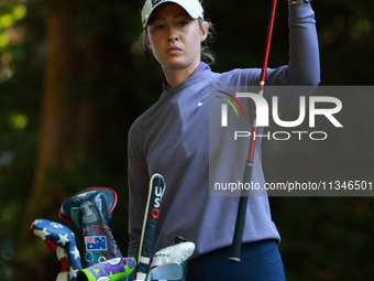 Nelly Korda of the United States pulls a club from her bag as she prepares to tee off on16th hole during Day One of the KPMG Women's PGA Cha...