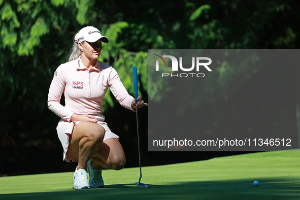 Charley Hull of England lines up her putt on the 15th green during Day One of the KPMG Women's PGA Championship at Sahalee Country Club in S...