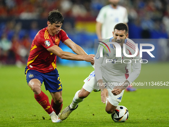 Robin Le Normand centre-back of Spain and Real Sociedad and Lorenzo Pellegrini attacking midfield of Italy and AS Roma compete for the ball...