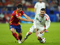 Robin Le Normand centre-back of Spain and Real Sociedad and Lorenzo Pellegrini attacking midfield of Italy and AS Roma compete for the ball...