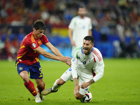 Robin Le Normand centre-back of Spain and Real Sociedad and Lorenzo Pellegrini attacking midfield of Italy and AS Roma compete for the ball...