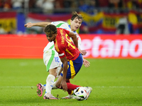 Lamine Yamal right winger of Spain and FC Barcelona and Nicolo Barella central midfield of Italy and Inter Milan compete for the ball during...