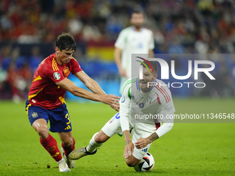 Robin Le Normand centre-back of Spain and Real Sociedad and Lorenzo Pellegrini attacking midfield of Italy and AS Roma compete for the ball...