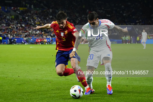 Robin Le Normand centre-back of Spain and Real Sociedad and Mattia Zaccagni left winger of Italy and SS Lazio compete for the ball during th...