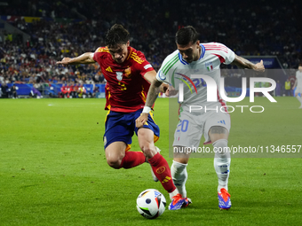 Robin Le Normand centre-back of Spain and Real Sociedad and Mattia Zaccagni left winger of Italy and SS Lazio compete for the ball during th...