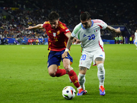 Robin Le Normand centre-back of Spain and Real Sociedad and Mattia Zaccagni left winger of Italy and SS Lazio compete for the ball during th...