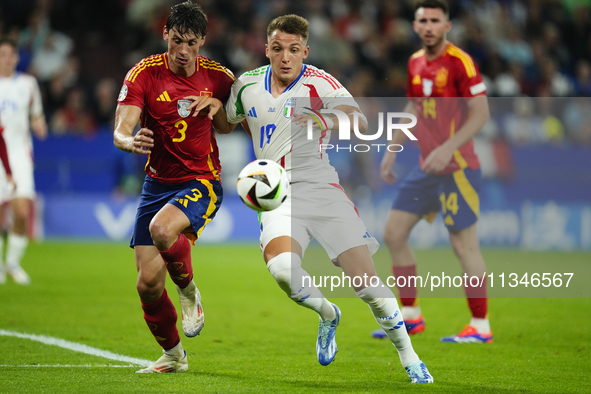 Robin Le Normand centre-back of Spain and Real Sociedad and Mateo Retegui centre-forward of Italy and Genoa CFC compete for the ball during...