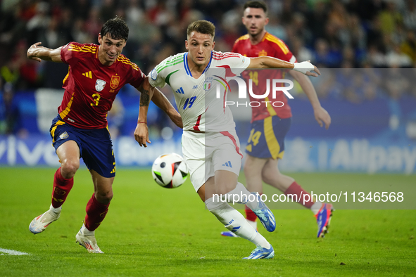 Robin Le Normand centre-back of Spain and Real Sociedad and Mateo Retegui centre-forward of Italy and Genoa CFC compete for the ball during...