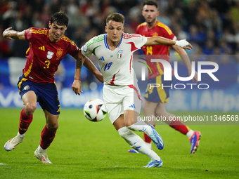 Robin Le Normand centre-back of Spain and Real Sociedad and Mateo Retegui centre-forward of Italy and Genoa CFC compete for the ball during...