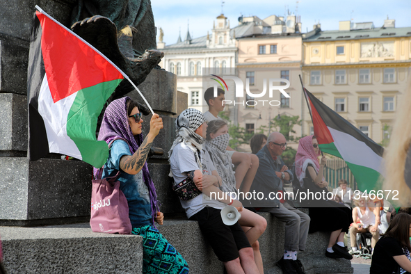 People are participating in a solidarity protest with Palestine in Krakow, Poland, on June 20, 2024, and are marching from the Main Square t...