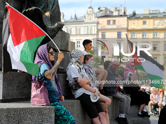 People are participating in a solidarity protest with Palestine in Krakow, Poland, on June 20, 2024, and are marching from the Main Square t...