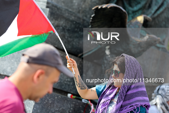 People are participating in a solidarity protest with Palestine in Krakow, Poland, on June 20, 2024, and are marching from the Main Square t...