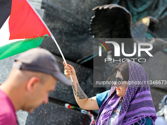 People are participating in a solidarity protest with Palestine in Krakow, Poland, on June 20, 2024, and are marching from the Main Square t...