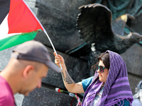 People are participating in a solidarity protest with Palestine in Krakow, Poland, on June 20, 2024, and are marching from the Main Square t...