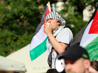 People are participating in a solidarity protest with Palestine in Krakow, Poland, on June 20, 2024, and are marching from the Main Square t...