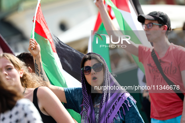 People are participating in a solidarity protest with Palestine in Krakow, Poland, on June 20, 2024, and are marching from the Main Square t...