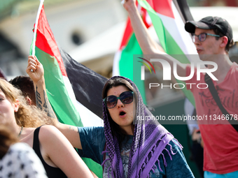 People are participating in a solidarity protest with Palestine in Krakow, Poland, on June 20, 2024, and are marching from the Main Square t...