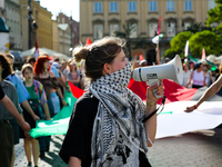 People are participating in a solidarity protest with Palestine in Krakow, Poland, on June 20, 2024, and are marching from the Main Square t...