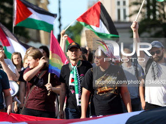 People are participating in a solidarity protest with Palestine in Krakow, Poland, on June 20, 2024, and are marching from the Main Square t...