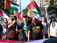 People are participating in a solidarity protest with Palestine in Krakow, Poland, on June 20, 2024, and are marching from the Main Square t...